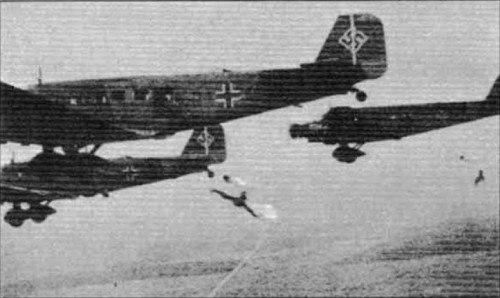 Parašutisté vyskakují z letounu Ju-52